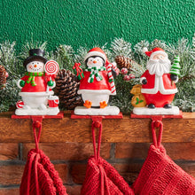 Load image into Gallery viewer, 6.5"H Resin Santa, Snowman, Penguin Stocking Holders, Set of 3