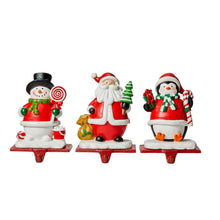Load image into Gallery viewer, 6.5"H Resin Santa, Snowman, Penguin Stocking Holders, Set of 3